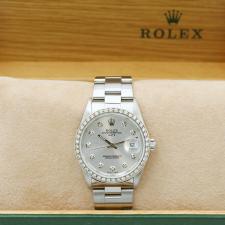 Gents Rolex Date 15200 Stainless Steel case with Silver Diamond Set dial